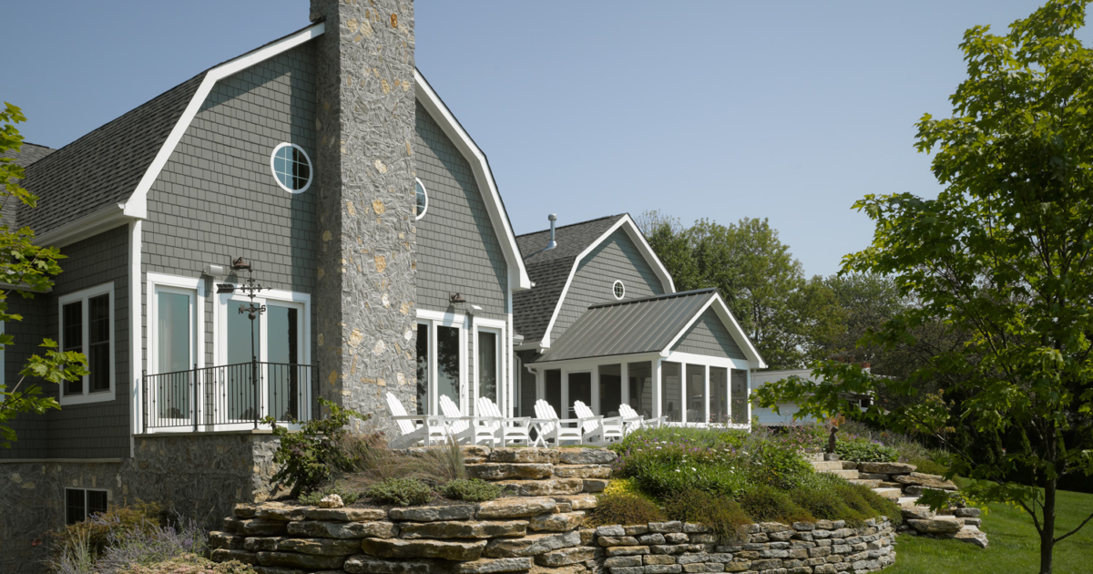 Grey house with brick cheap